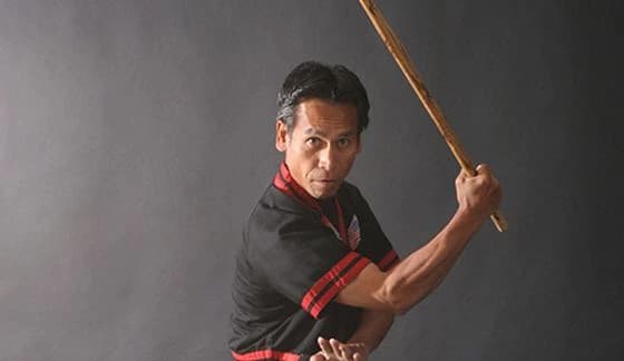 Instructor demonstrating arnis stick techniques